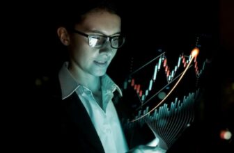 woman with glasses pointing at forex chart
