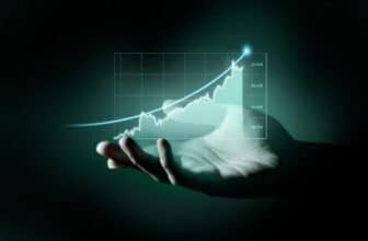 hand holding virtual trading chart going up