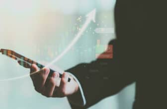 handing holding phone with virtual forex chart