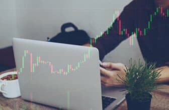 back of laptop with forex chart overlay